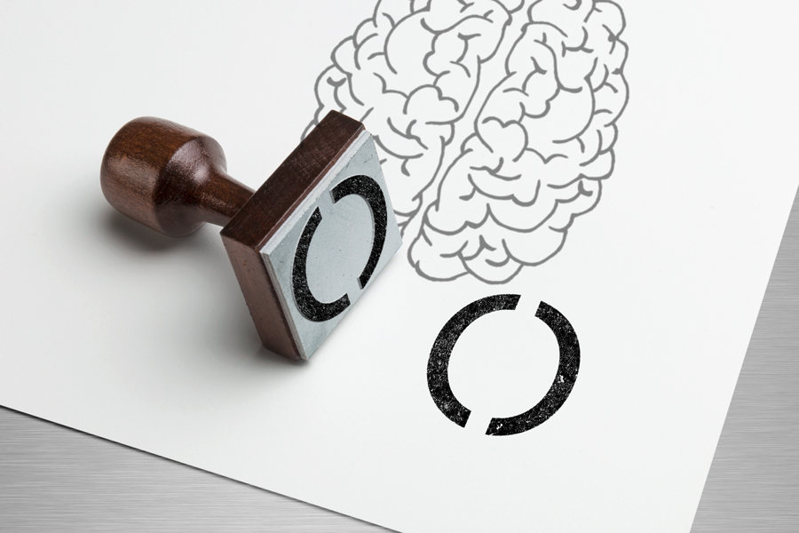 Kunde Brainbow: Signetsptempel mit Symbolbild Brain auf dem Papier