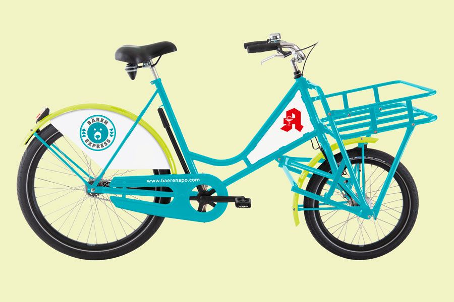 Fahrrad mit Bären-Express Werbung und Domain in den Corporate Design Farben
